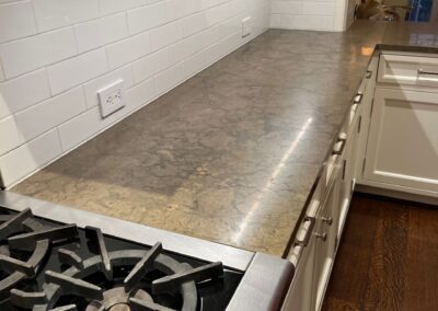 A stove top oven sitting inside of a kitchen